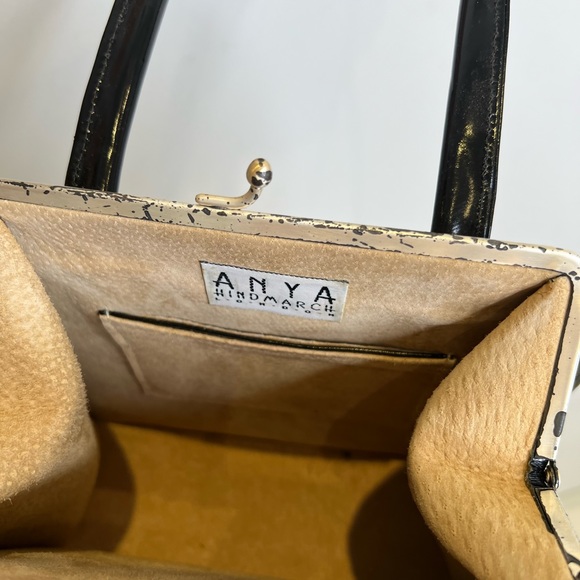 Anya Hindmarch black patent leather top handle, hard frame handbag. - Picture 3 of 3